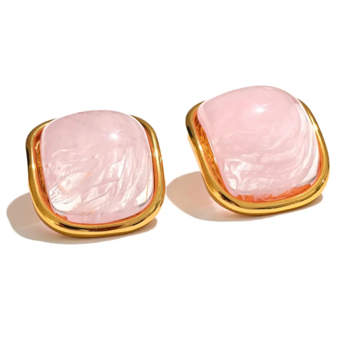 Pair of square pink gemstone stud earrings with gold frames on white background