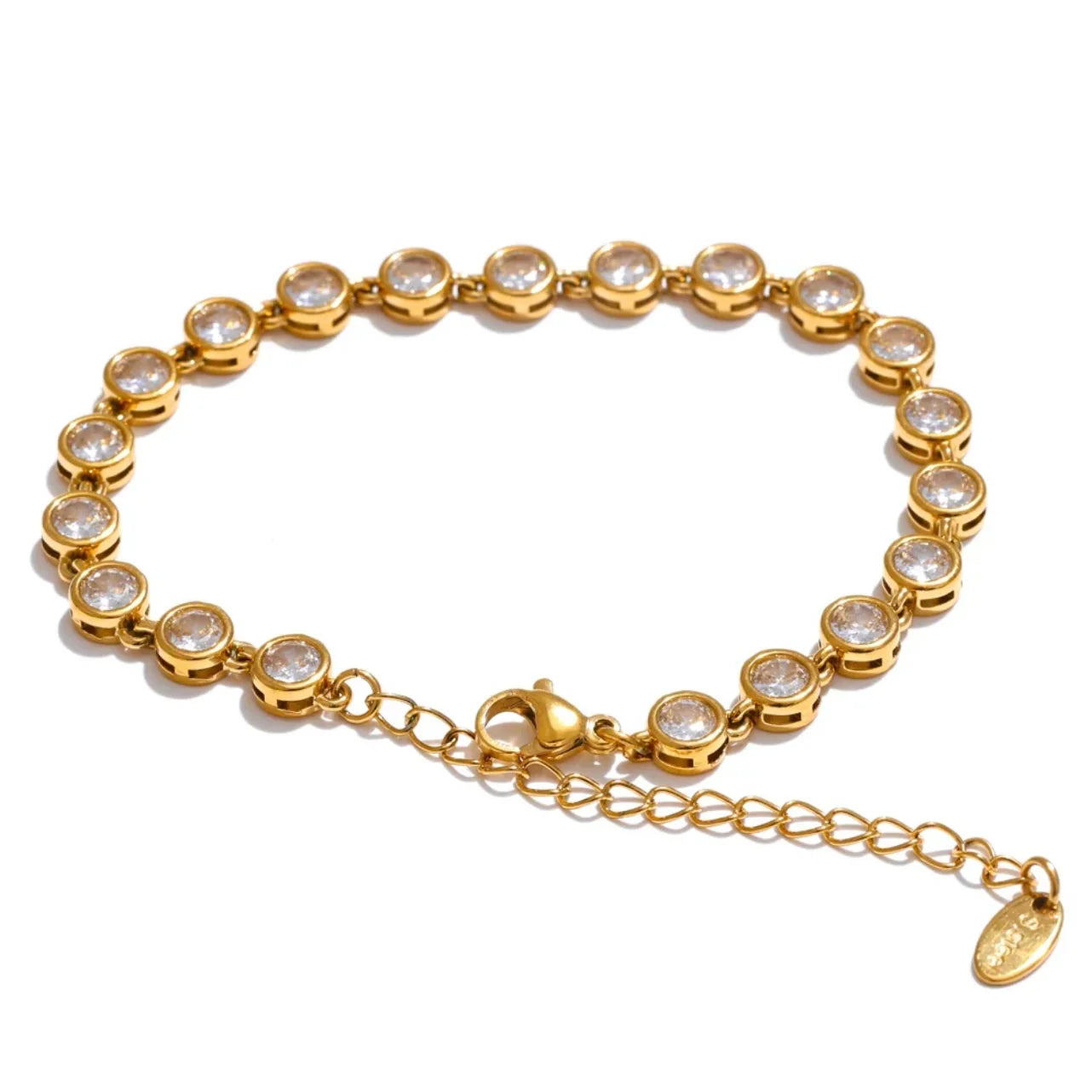 Gold tennis bracelet with round clear gemstones and adjustable chain clasp on white background